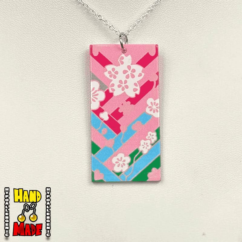 Acrylic Cherry Blossom Hanafuda Anime Necklace on a white display with a bold, pink-themed charm and silver-plated chain.