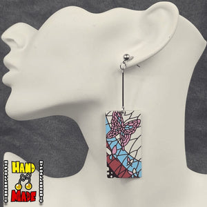 Acrylic Mosaic Butterfly Hanafuda Anime Earrings shown on a white molded display, featuring detailed butterfly mosaic charms on silver dropped posts.