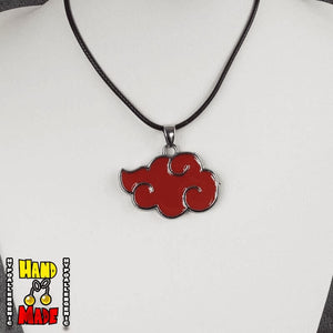 An oversized red cloud-shaped pendant on a black necklace, displayed on a mannequin neck.