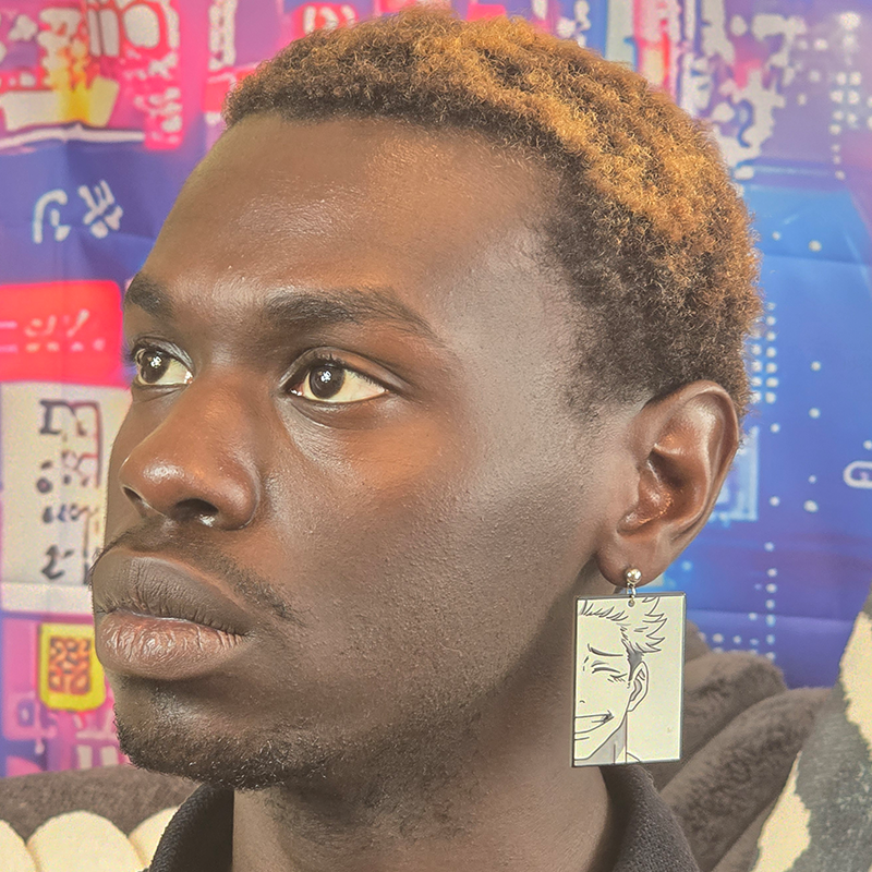 Model wearing Dual Vessel Anime Earrings with mismatched acrylic anime character charms and silver French hook ear wires.