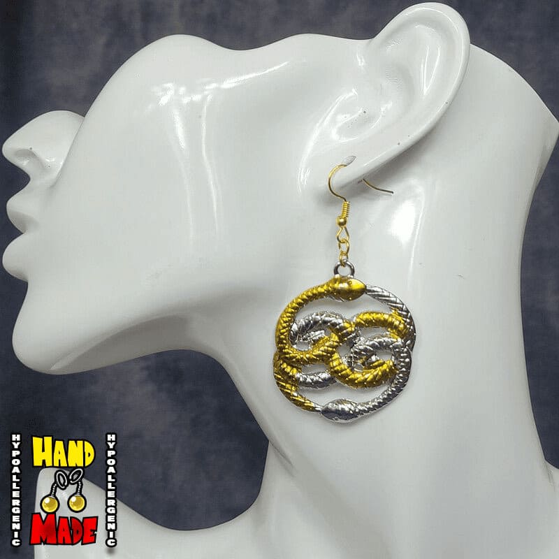 Handmade Double Ouroboros Movie Earrings featuring intertwined gold and silver snake charm with gold French hooks.