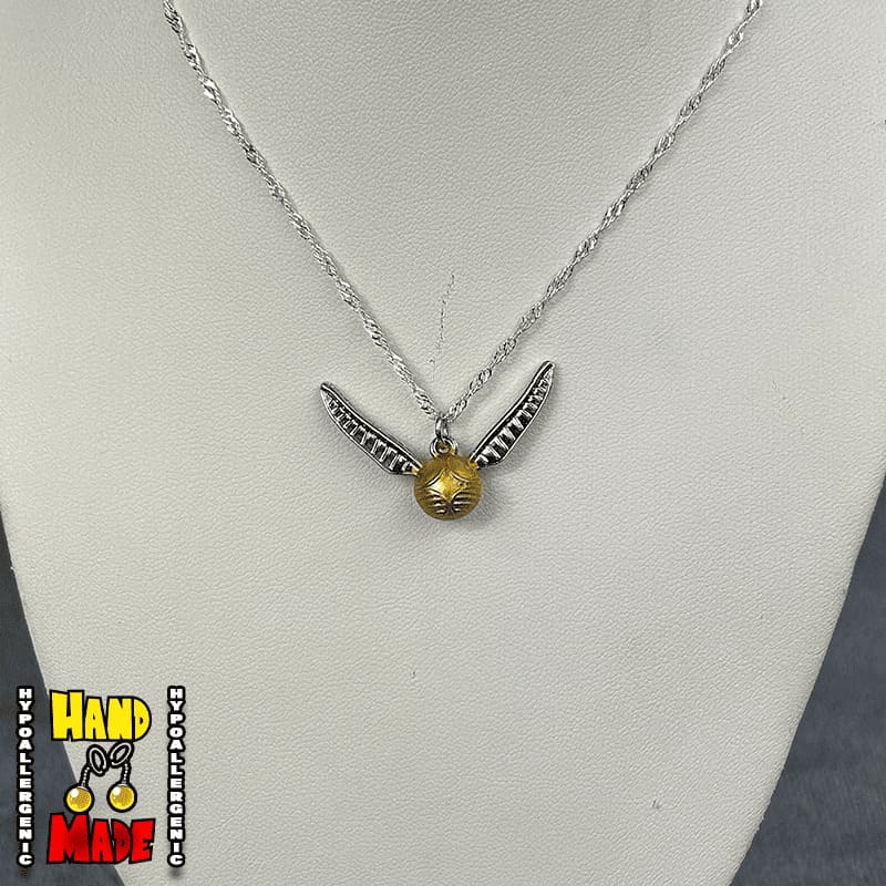 Handmade Golden Winged Orb Fantasy Necklace featuring golden winged orb charm on a silver chain necklace.