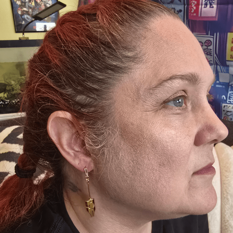 Model image of a model wearing the earrings previously described.