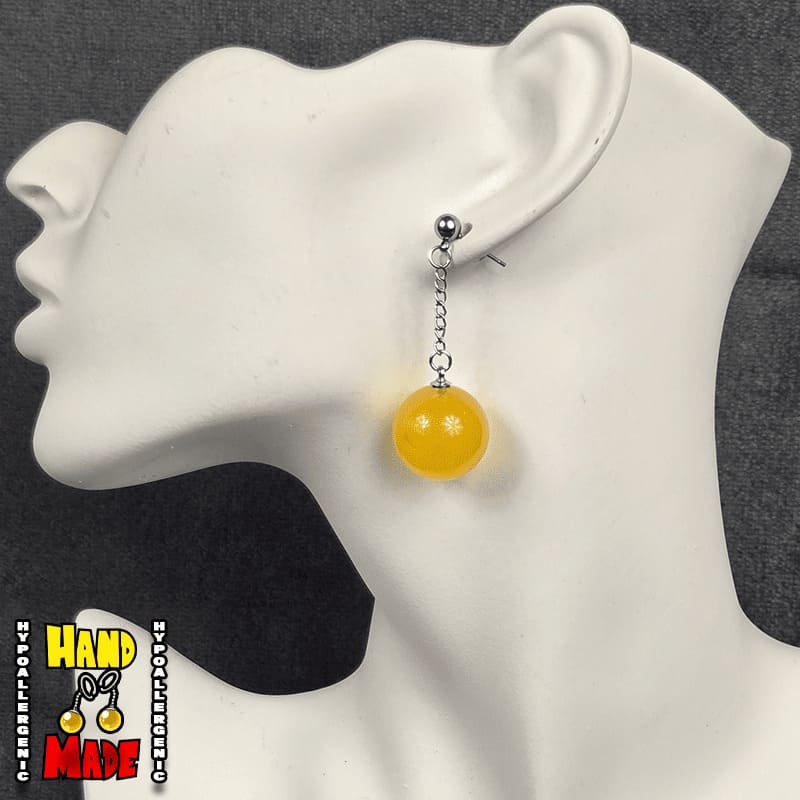 Gold Plastic Sphere, hanging from a chain, attached to a silver dropped post.