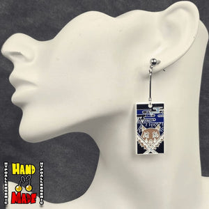 Metal Boar Mask Hanafuda Anime Earrings with detailed boar-head motifs, displayed on a white earring stand with sterling silver dropped posts.
