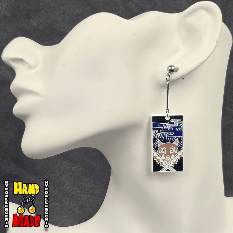Metal Boar Mask Hanafuda Anime Earrings with detailed boar-head motifs, displayed on a white earring stand with sterling silver dropped posts.