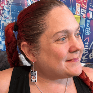 Model wearing Metal Boar Mask Hanafuda Anime Earrings with metal boar mask charms and sterling silver dropped posts.