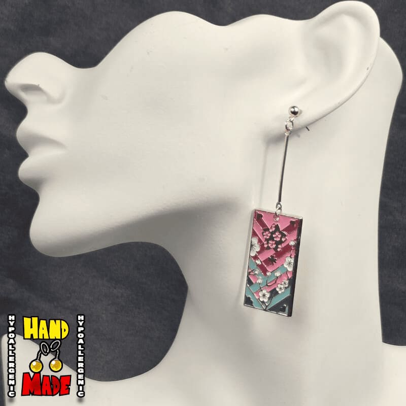 Metal Cherry Blossom Hanafuda Anime Earrings shown on a white molded display with polished gold charms and gold dropped posts.