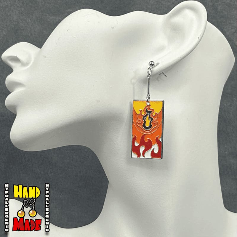 Metal Fire Breathing Hanafuda Anime Earrings displayed on a white molded earring stand, showing flame motif design and dropped posts