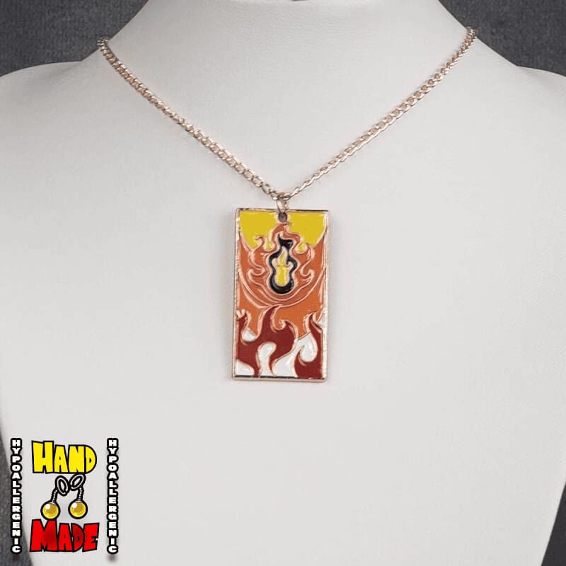 Metal Fire Breathing Hanafuda Anime Necklace displayed on a white flat stand with a flame motif metal charm and rose gold chain.