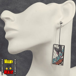 Metal Mosaic Butterfly Hanafuda Anime Earrings displayed on a white molded stand with silver dropped posts and polished metal butterfly on mosaic style hanafuda charm.