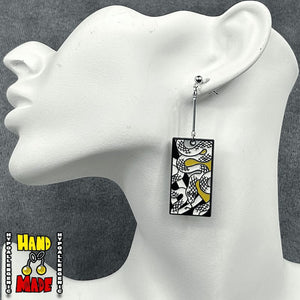 Metal Snakes Hanafuda Anime Earrings shown on a white molded display with polished silver snake charms and silver dropped posts.