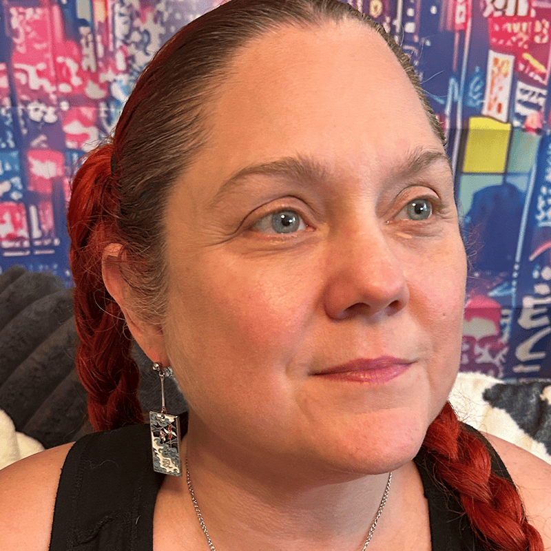 Model wearing the Metal Windmills Hanafuda Anime Earrings, showing the windmill-inspired metal charms with gold dropped posts for a bold anime look.