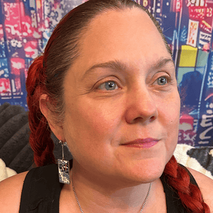 Model wearing the Metal Windmills Hanafuda Anime Earrings, showing the windmill-inspired metal charms with gold dropped posts for a bold anime look.