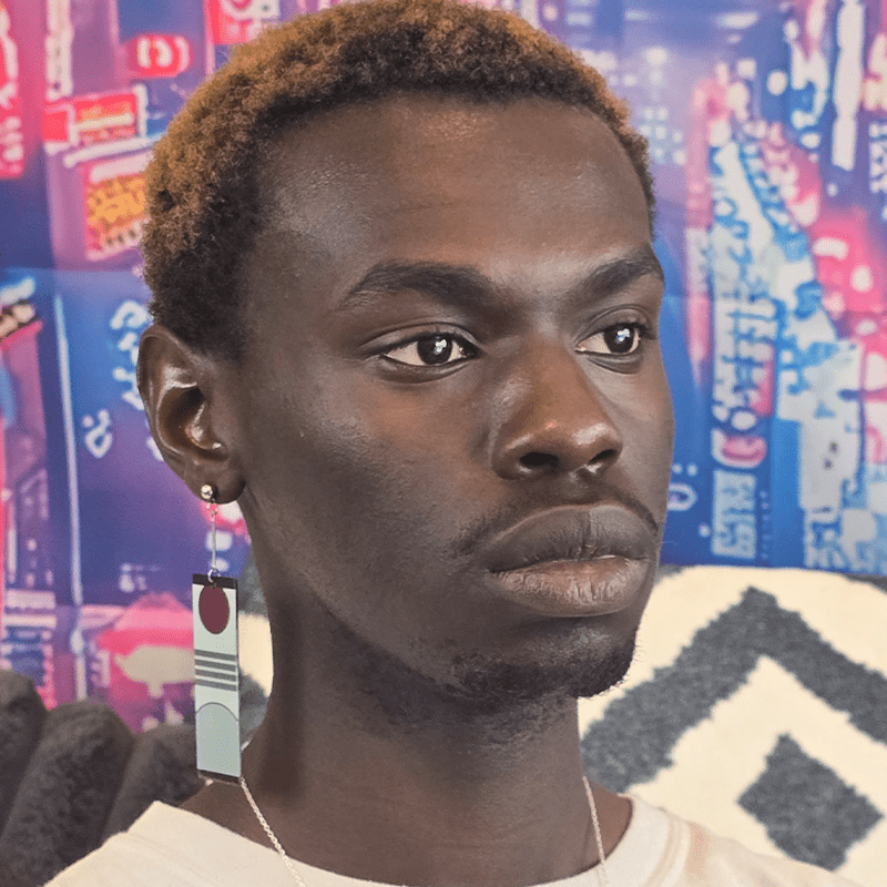 Model image of the hanafuda style earring with a rising sun above three horizontal gray stripes on a light gray background. Gray hilside at the bottom of the earring. Black bars border the top and bottom. Paired with silver jewelry extender and silver dropped posts.