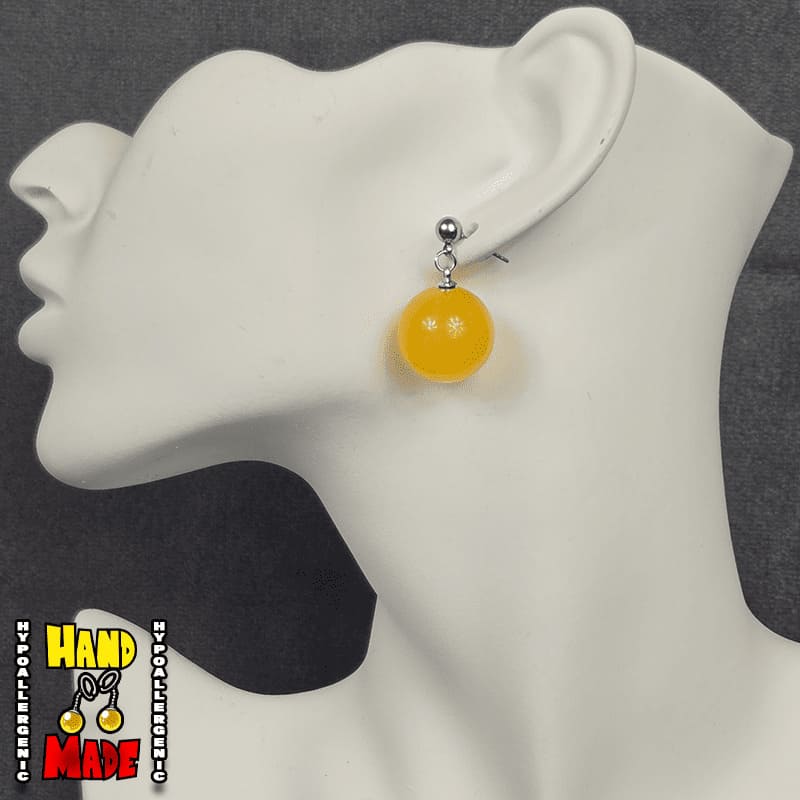 Gold Plastic Sphere, hanging from a silver dropped post.