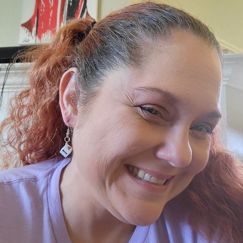 A model image of a model wearing the previously described earrings.