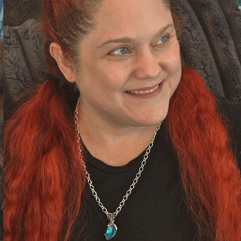 A model image of a model wearing the previously described necklace.