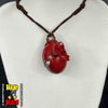A hand-painted red egg-shaped pendant necklace inspired by the Berserk anime franchise, displayed on a mannequin neck.