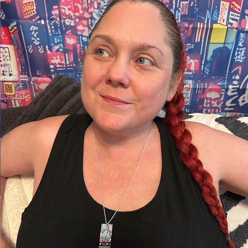 Person wearing the Acrylic Butterfly Hanafuda Anime Necklace, showing the delicate butterfly charm and silver chain resting at the neckline.