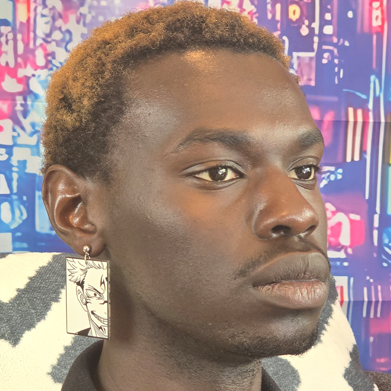 Model wearing Dual Vessel Anime Earrings with mismatched acrylic anime character charms and silver French hook ear wires.