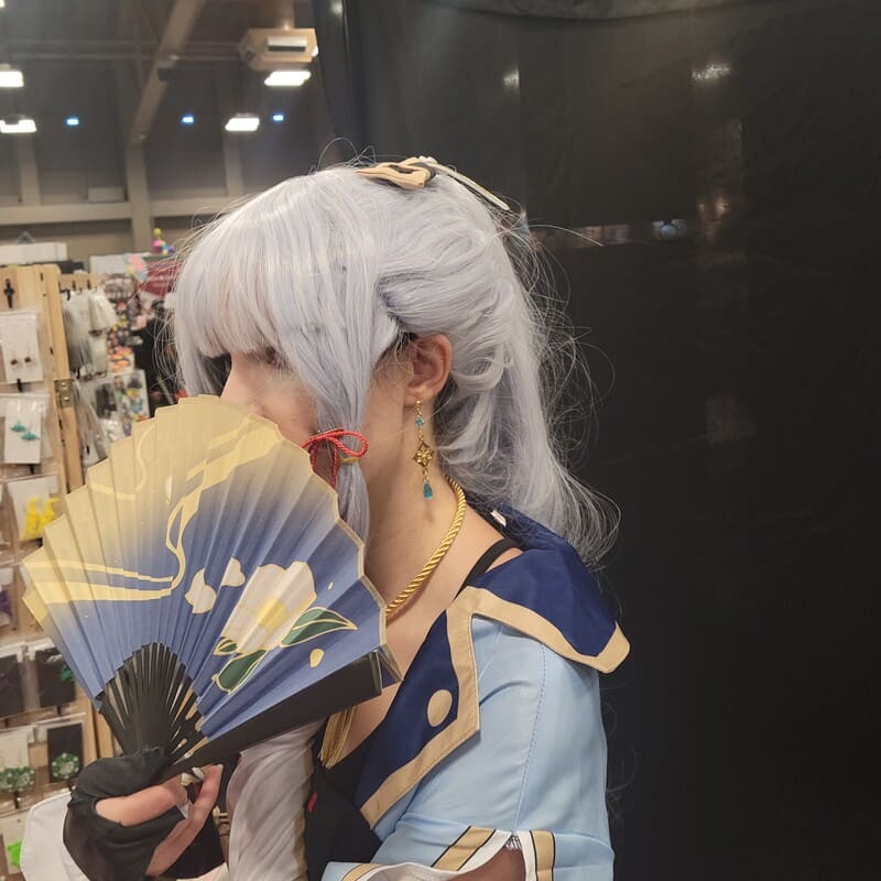 Model wearing Elemental Power Gaming Earrings with gold elemental charms and colored beads.