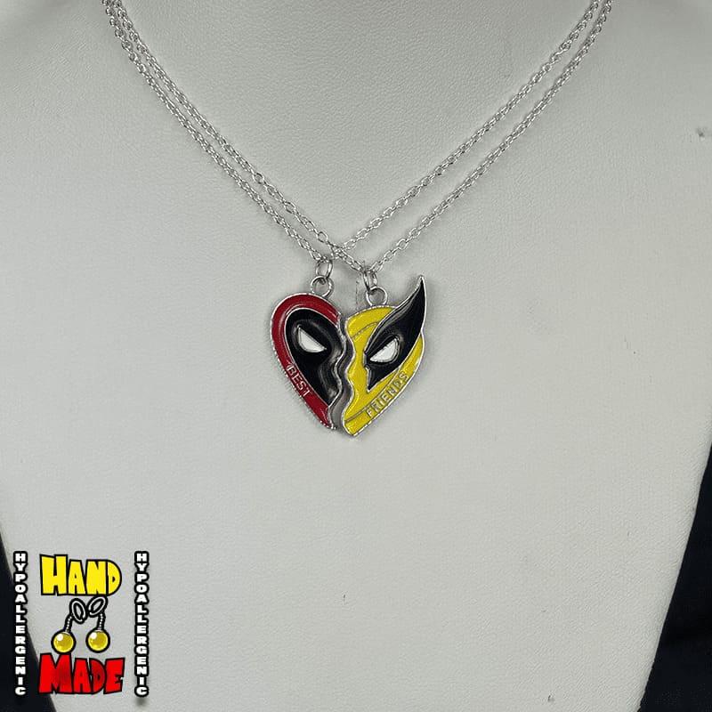 Handmade Masked Duo Friendship Necklace featuring mismatched metal mask charms on a silver chain necklace.