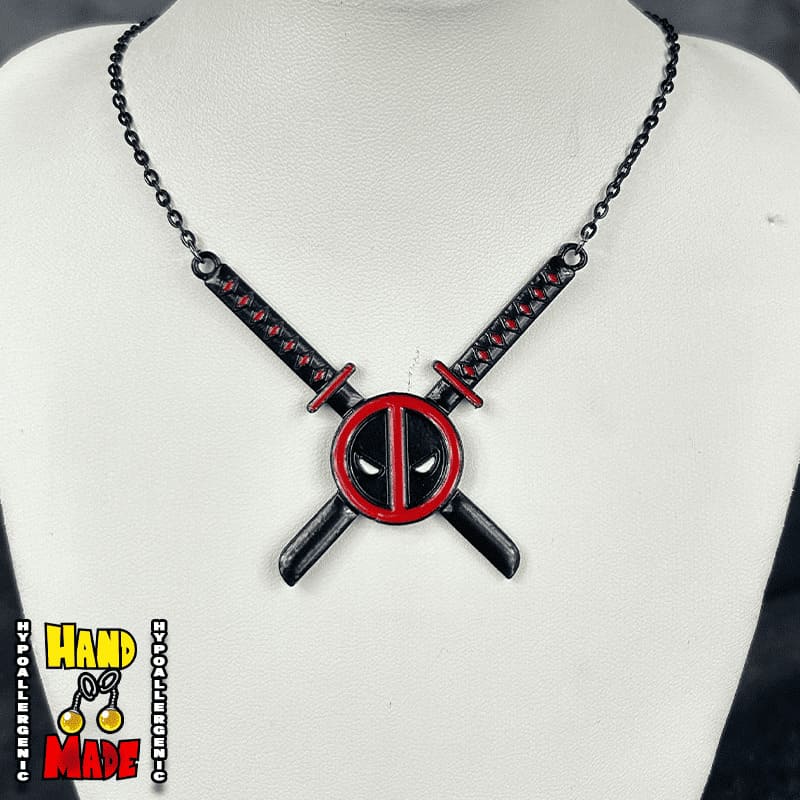 Handmade Masked Mercenary Sword Necklace featuring metal mask charm with crossed swords on a black chain necklace.
