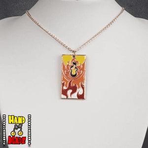 Metal Fire Breathing Hanafuda Anime Necklace displayed on a white flat stand with a flame motif metal charm and rose gold chain.