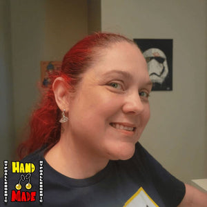 A model image of a model wearing the previously described earrings.